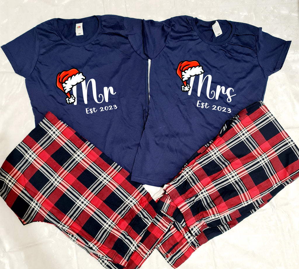 Navy top and tartan trousers pyjamas personalised with Mr and Mrs with a santa hat design and date