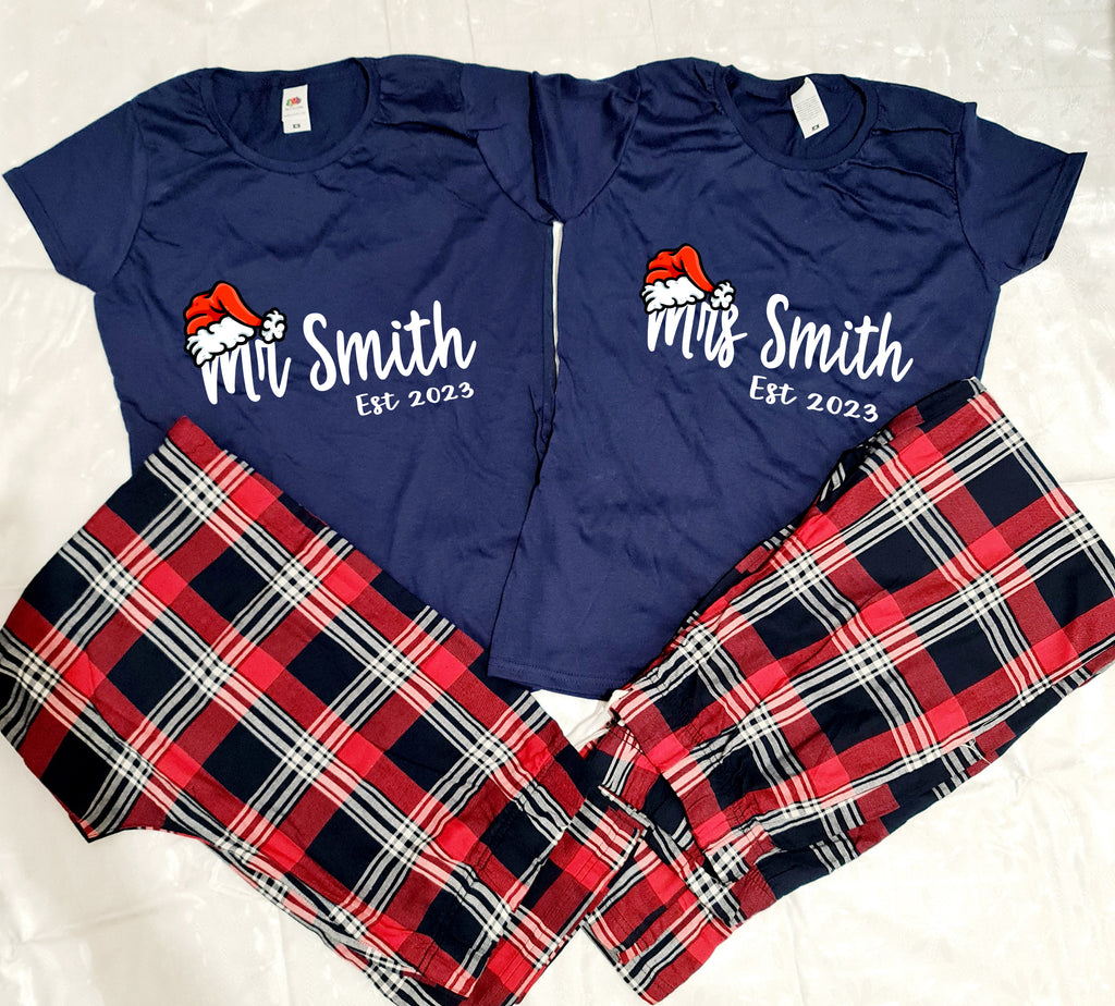 Personalised Mr and Mrs Santa hat pyjamas. Pyjamas consist of navy top and tartan trousers