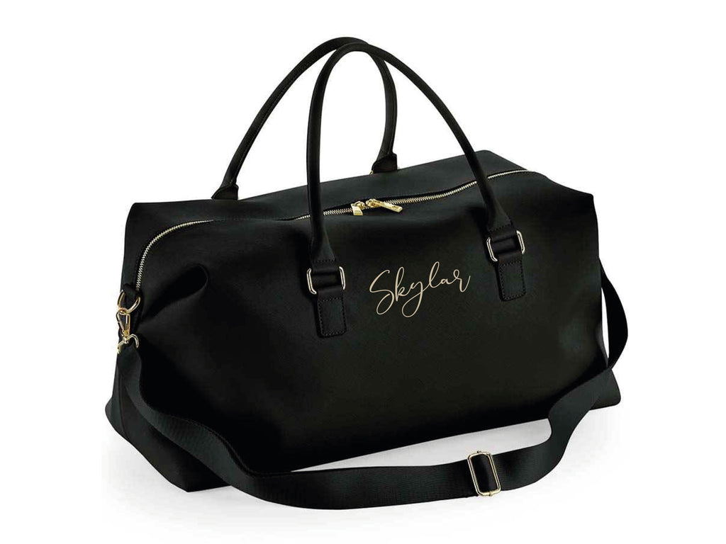 Personalised name weekend holdall bag in black. Made from Vegan leather