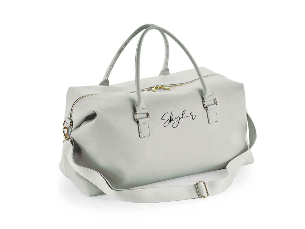 Personalised name weekend holdall bag in grey. Made from Vegan leather