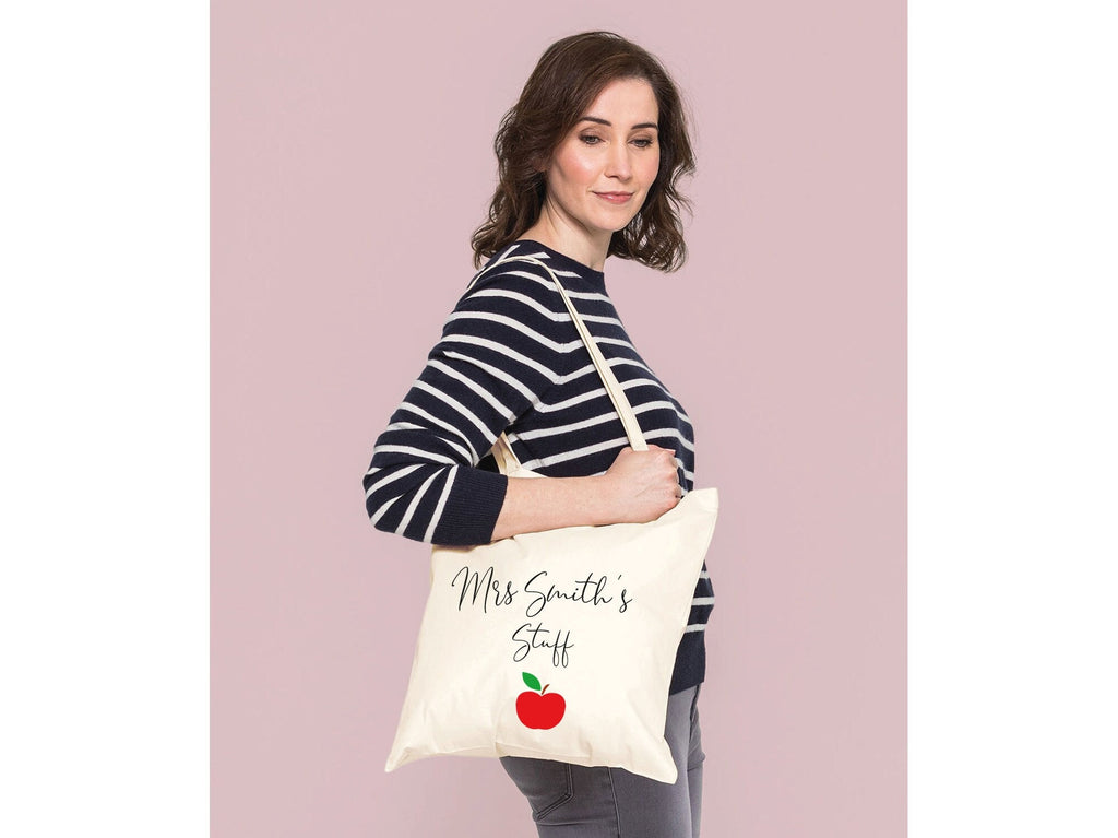 Teacher stuff tote bag. Personalised with name. Has a red apple design