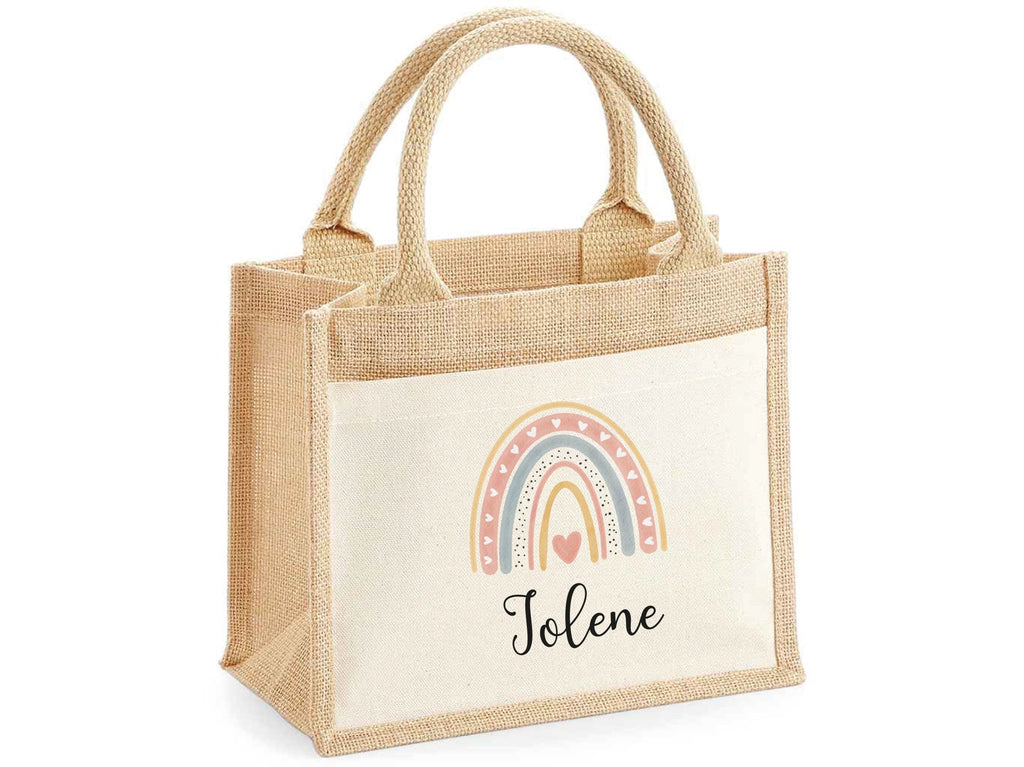 Personalised Tote bag with rainbow design and name. Bag is made from jute and a front panel made from cotton. 